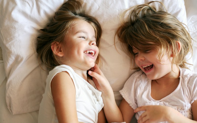 Happy children laughing together, celebrating spontaneous communication and social connection