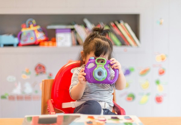 Child with headphones engaged calmly on tablet with zero internet required